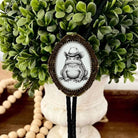 Frog bolo tie on adjustable cord.