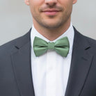 Dusty Sage bow tie worn by a groomsman in a wedding.
