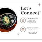 Circular belt buckle with turquoise center and intricate silver detailing on a dark background