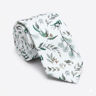 Floral tie for men displayed on a white background with sage green greenery.
