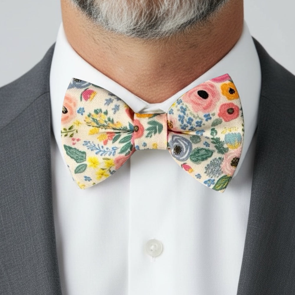 Groomsman in a floral bowtie in a wedding.