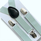 Sage green suspenders with silver clips for groomsmen, ring bearer and wedding suspenders on a white background