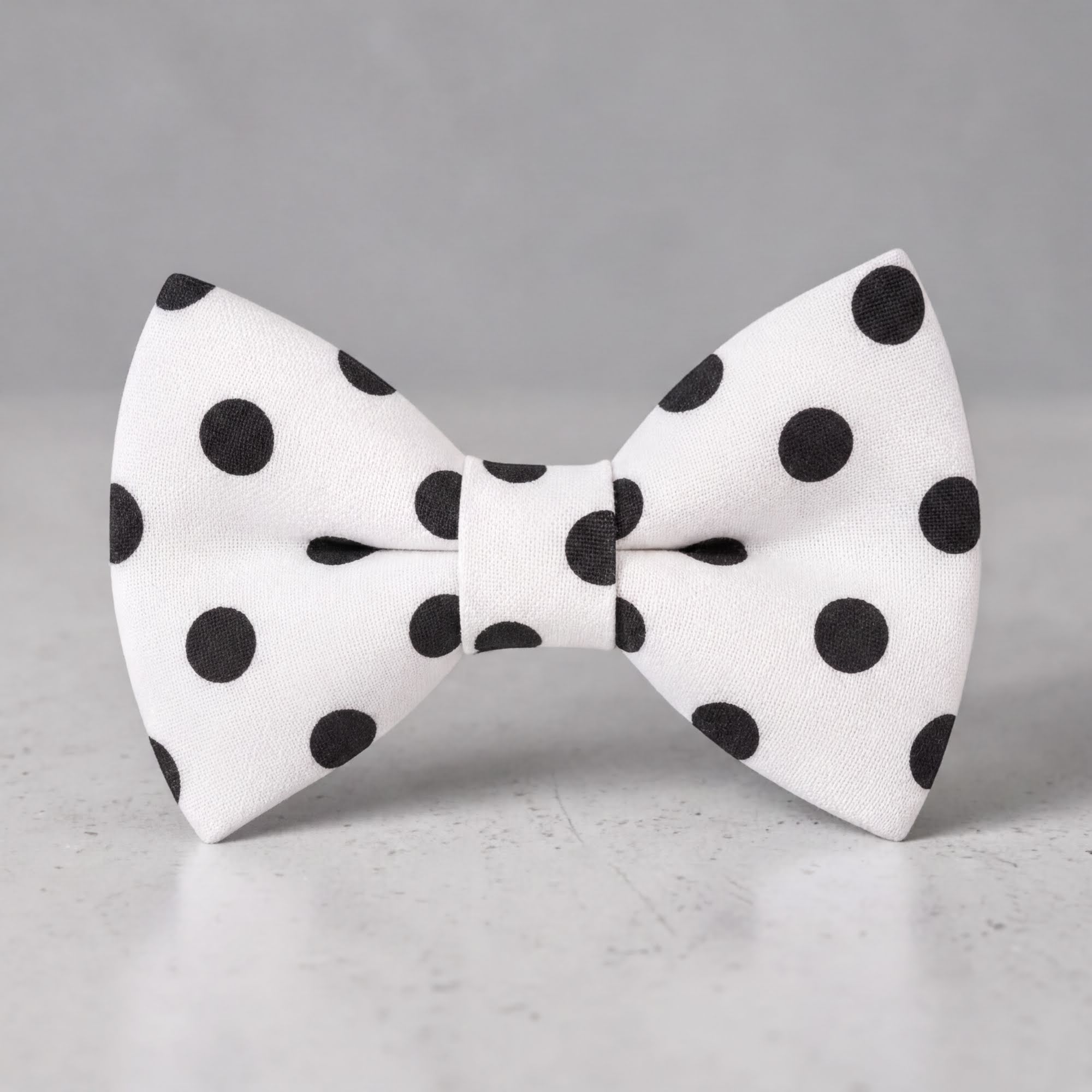 Black and white polkadot bow tie for men boys and toddlers.