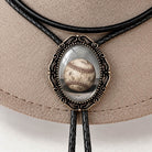 Baseball bolo tie with vintage frame and leather cord.