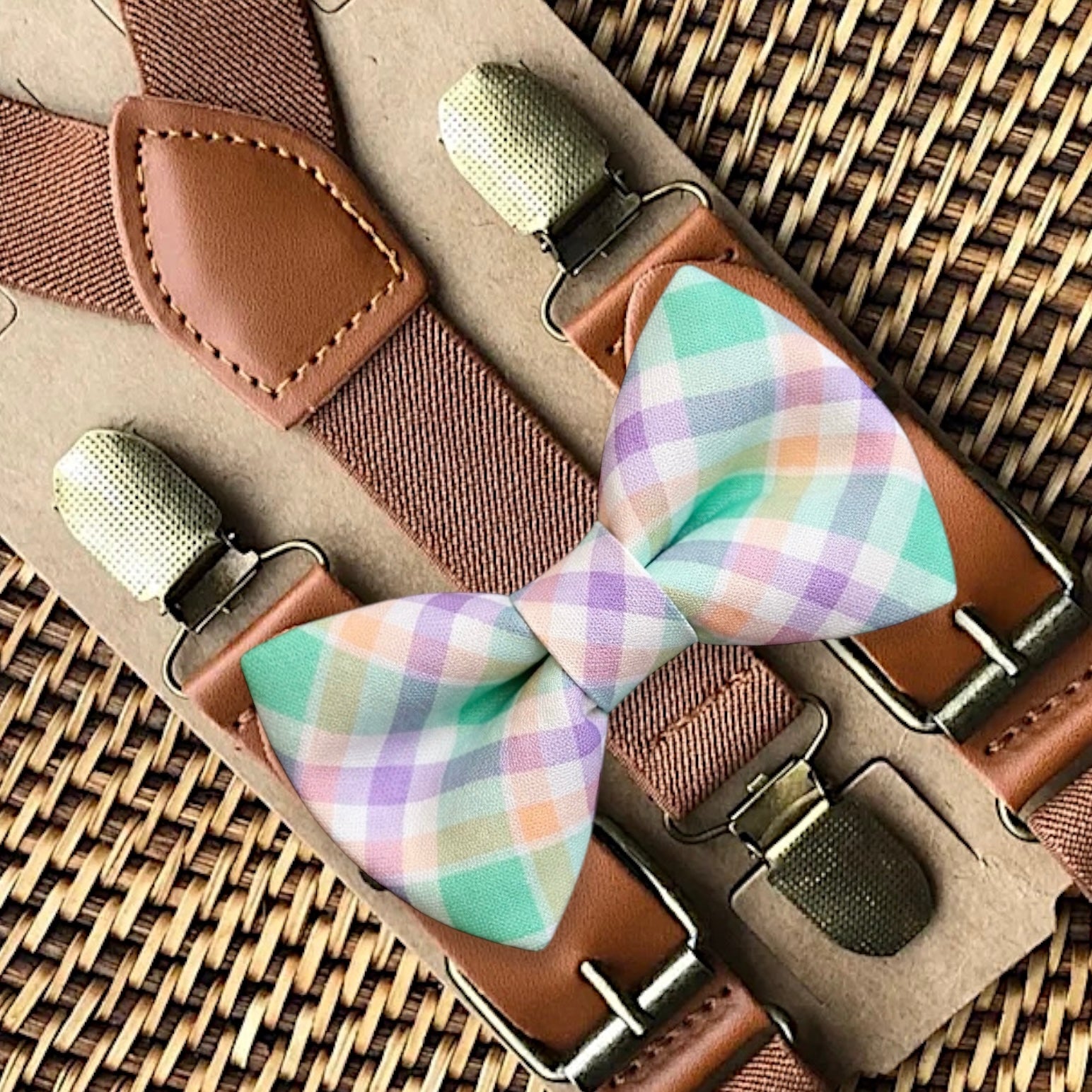 Handmade pre-tied Easter plaid bow tie paired with adjustable dark brown leather-look suspenders for a rustic holiday outfit.