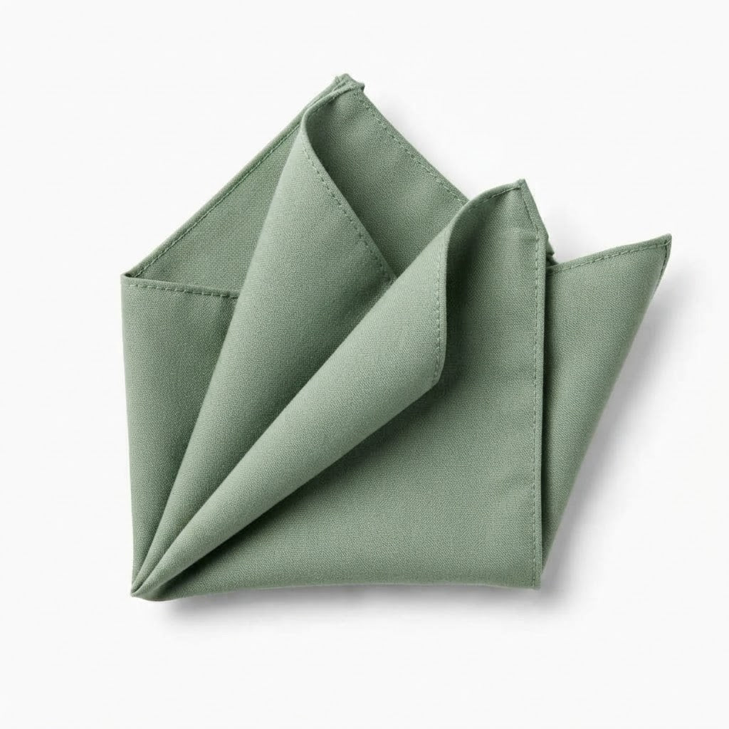 A folded green napkin is shown against a white background.