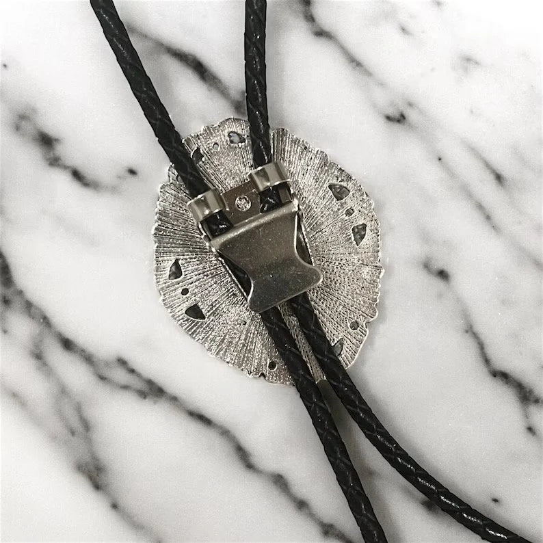 Silver bolo clasp on black leather cord