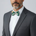 Groomsman in an emerald green floral bow tie.