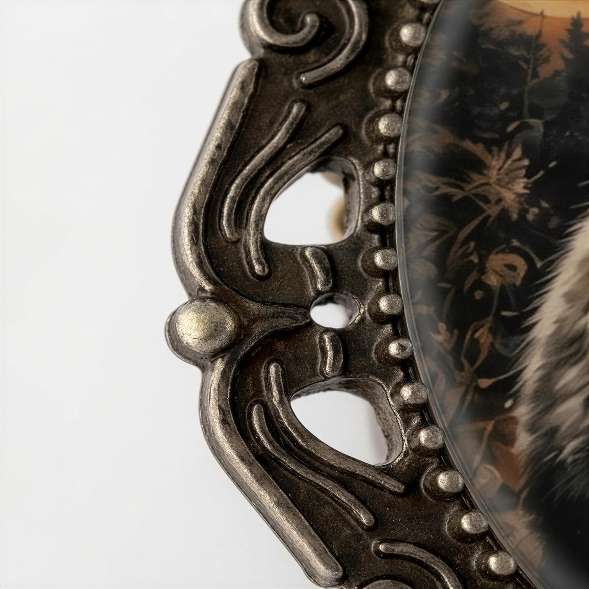 a close-up view of an ornate metal frame with a decorative design.