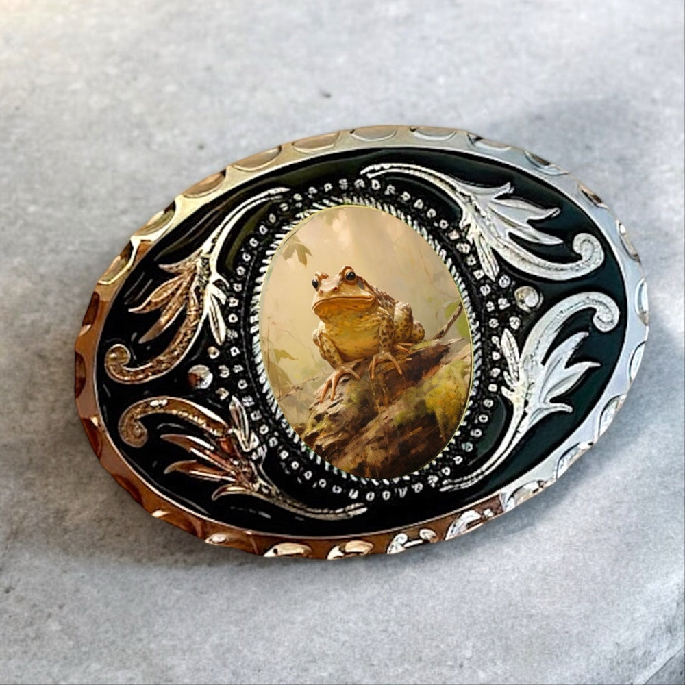 Belt buckle with frog design and intricate metalwork on a white background