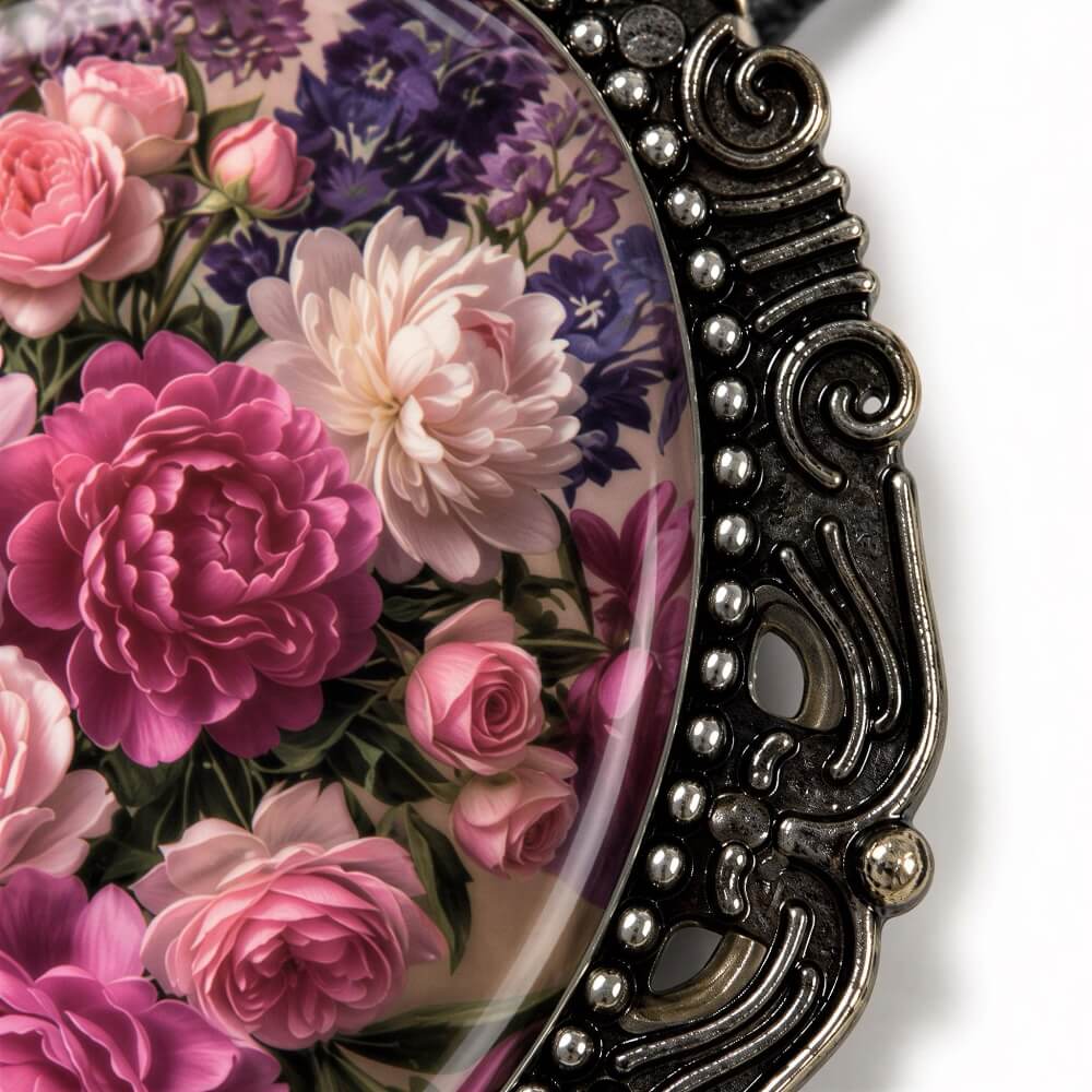 a close-up view of a decorative metal frame with a floral design on it. The frame is adorned with a variety of colorful flowers, including pink and purple roses, as well as other flowers with different colors and shapes. The frame has an ornate, decorative design with a scroll-like pattern around the edges.