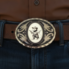 Opossum belt buckle on a cowboy with brown shirt and jeans.