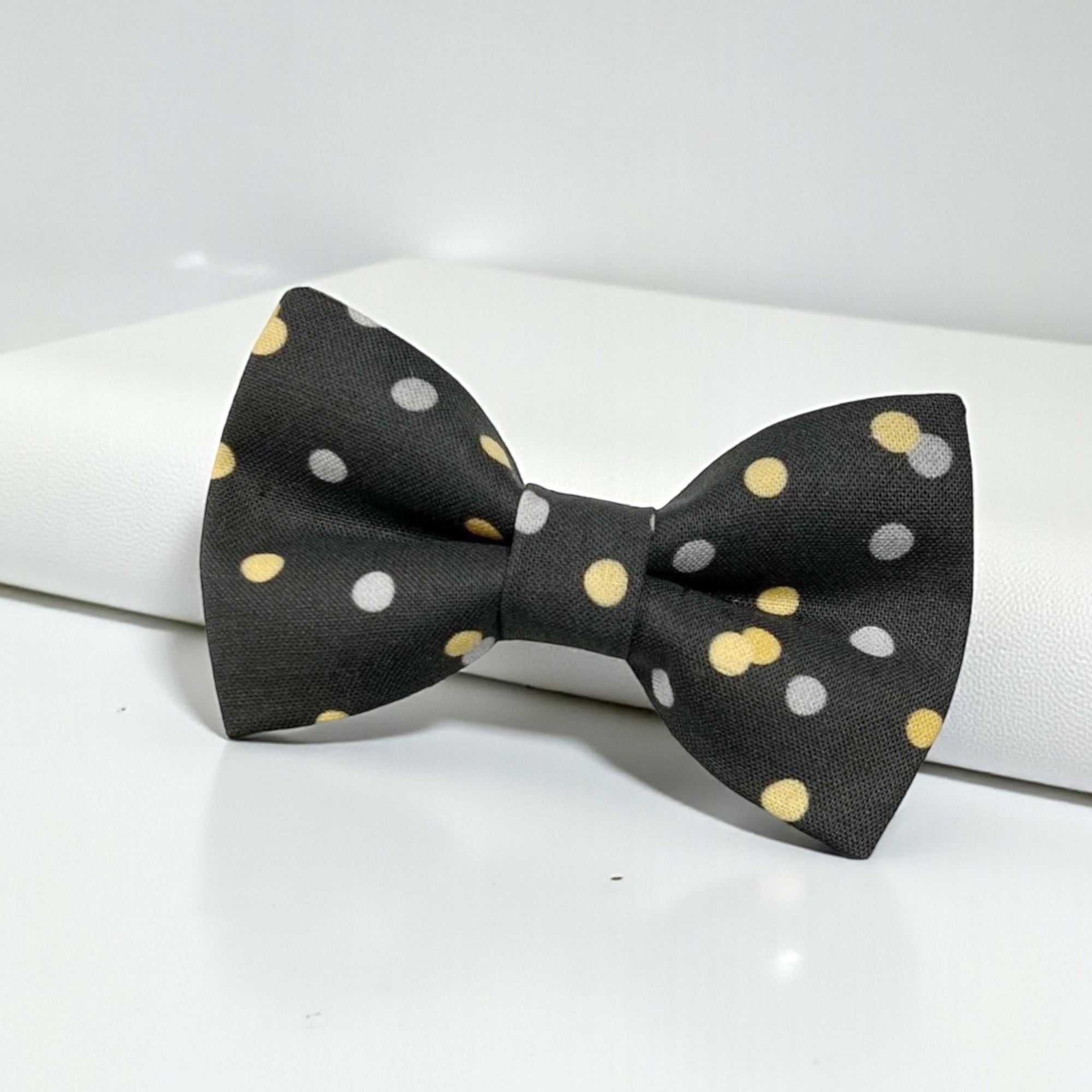 black tie with gold polka dots