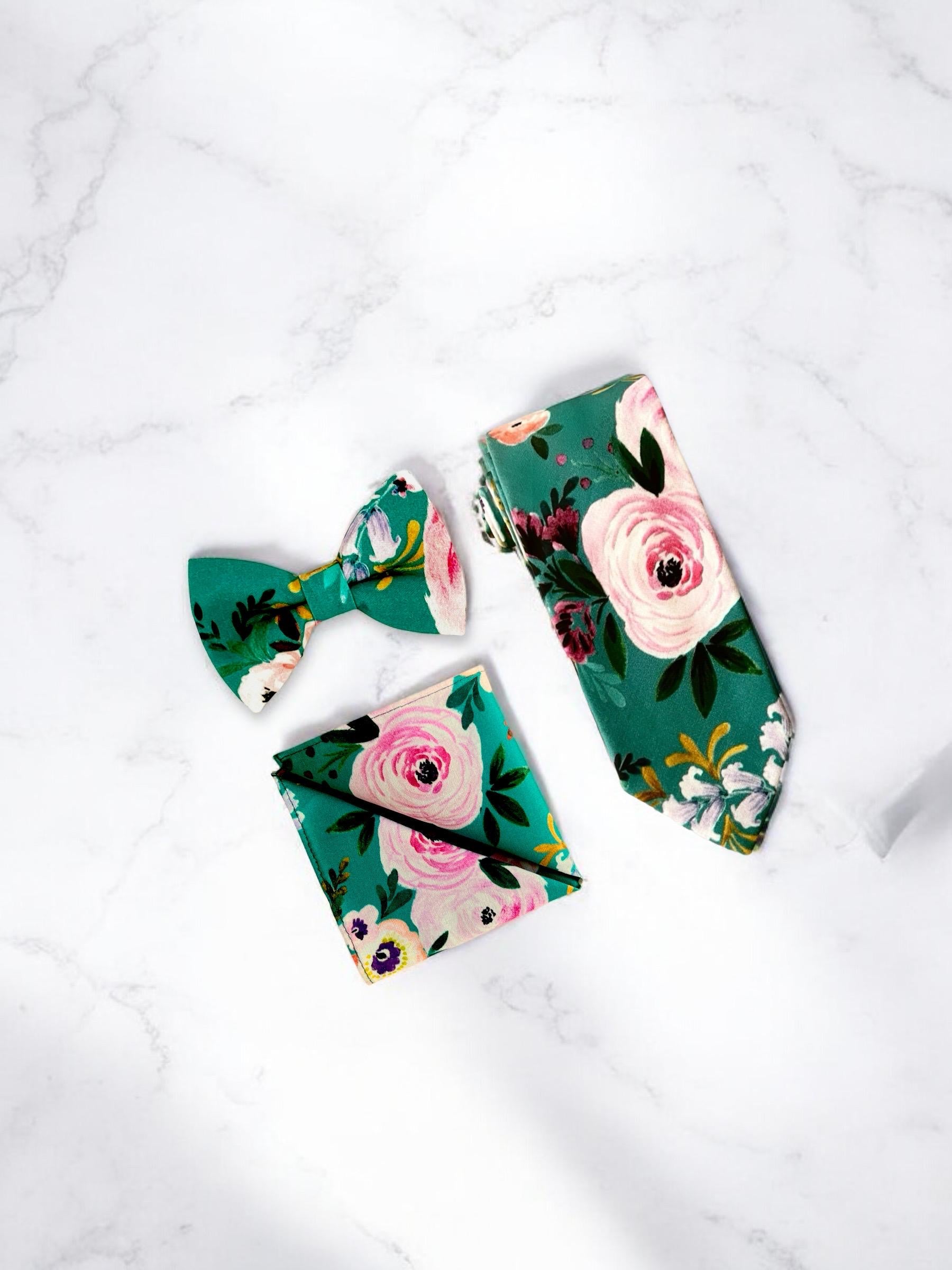 Teal floral necktie for men for wedding on a white marble counter