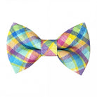 Size chart for pre-tied bow ties from The Bold Bow Tie detailing measurements across three sizes. Small is 3.5 inches wide and recommended for ages 6 months to 5 years. Medium is 4 inches wide and recommended for ages 6 to 12 years. Large is 4.5 inches wide and recommended for ages 13 years and up. Visual icons illustrate the relative sizes with horizontal arrows showing that width is measured from wingtip to wingtip. Bottom text notes that all bow ties are pre-tied and ready to add to your outfit.