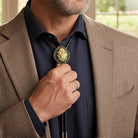 Man adjusting a May flower green lily of the valley bolo tie on his suit jacket with a blurred outdoor background