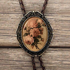 Dusty pink flowers glass cabochon groomsmen gift western jewelry dark braided string metal tips.