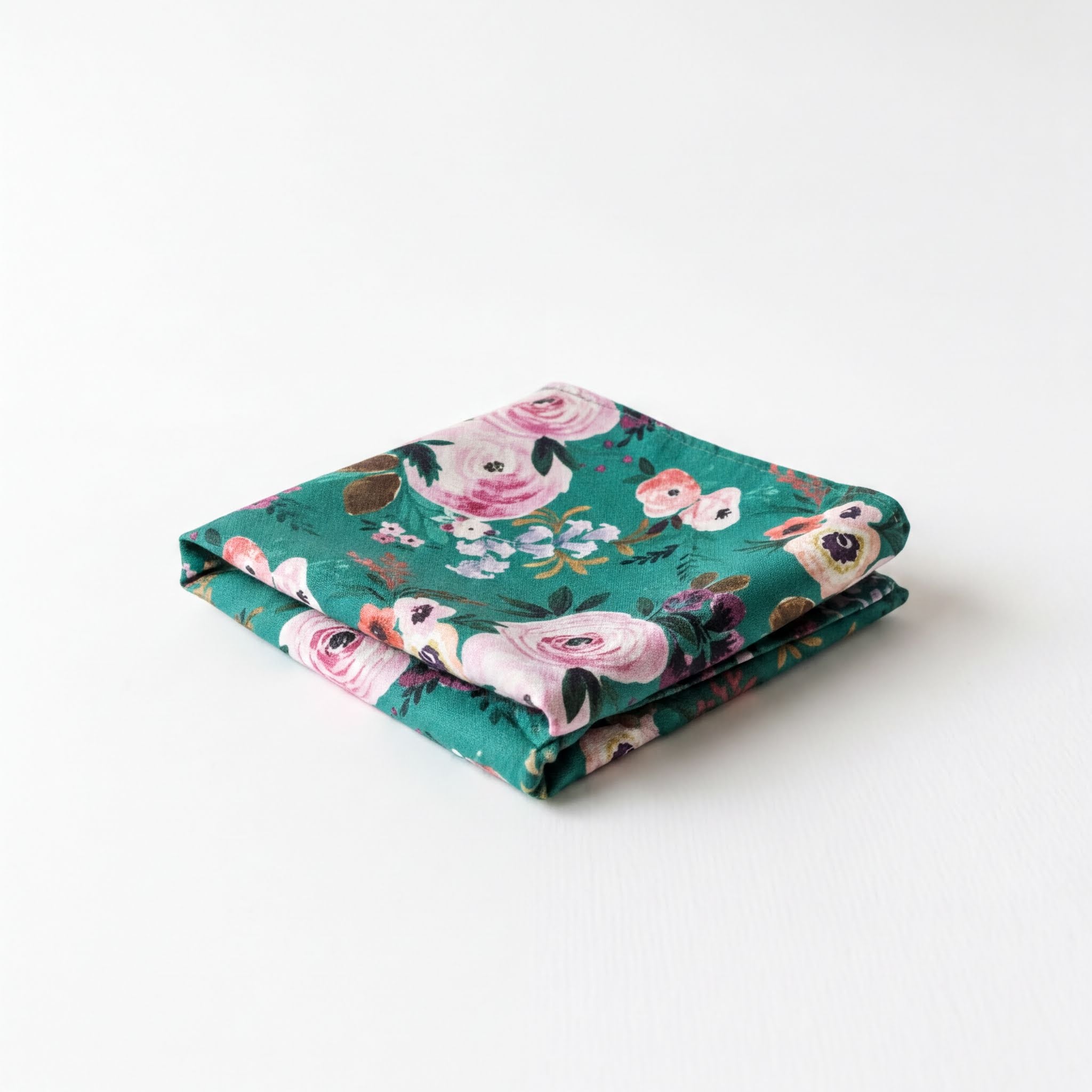 Pocket square for wedding with a floral pattern in shades of green and pink.