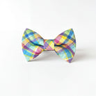 A colorful plaid bow tie is displayed against a white background.