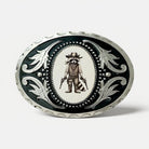 Decorative funny raccoon belt buckle with a raccoon wearing a cowboy hat and holding guns on a black background.