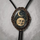 Celestial bolo tie with odd moon face.
