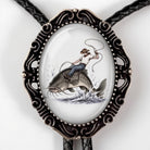 A decorative metal frame with a fish illustration on it.