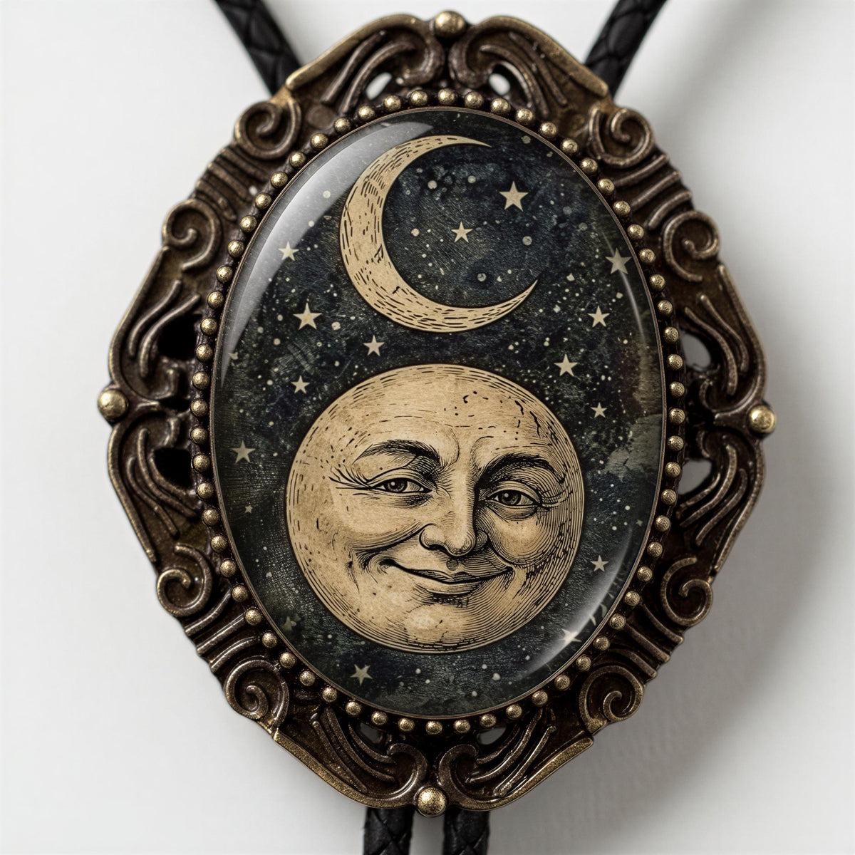 a pendant with a moon and stars design, encased in an ornate, decorative frame.