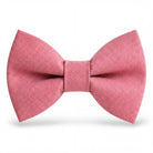 Size chart for pre-tied bow ties from The Bold Bow Tie detailing measurements across three sizes. Small is 3.5 inches wide and recommended for ages 6 months to 5 years. Medium is 4 inches wide and recommended for ages 6 to 12 years. Large is 4.5 inches wide and recommended for ages 13 years and up. Visual icons illustrate the relative sizes with horizontal arrows showing that width is measured from wingtip to wingtip. Bottom text notes that all bow ties are pre-tied and ready to add to your outfit.