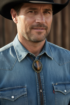Handsome cowboy in a tiger’s eye bolo tie.