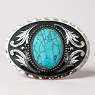 Belt buckle with turquoise stone and silver detailing on a light gray background
