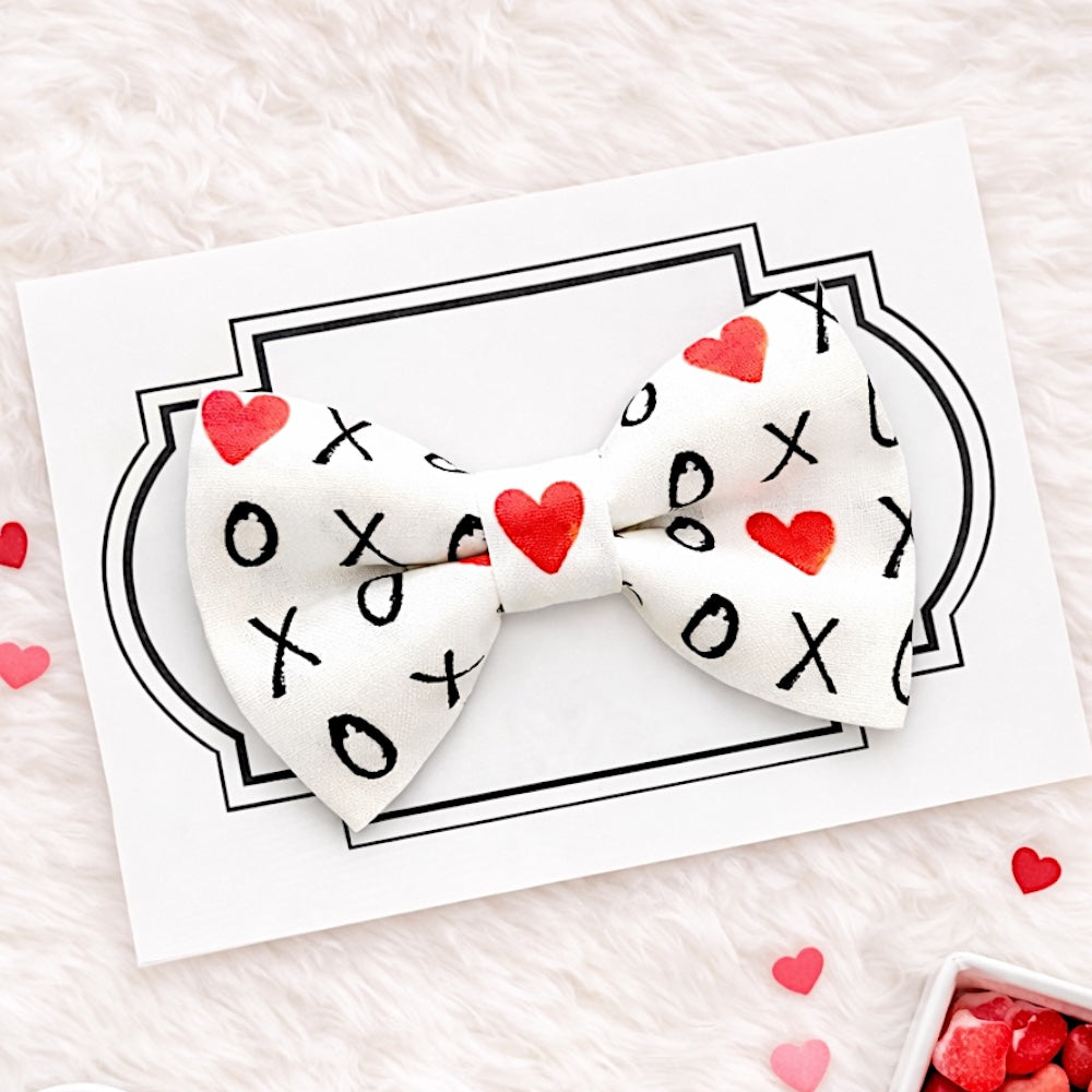Valentine’s Day Dog Bow Tie with hugs and kisses on it.