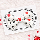 Valentine’s Day Dog Bow Tie with hugs and kisses on it.