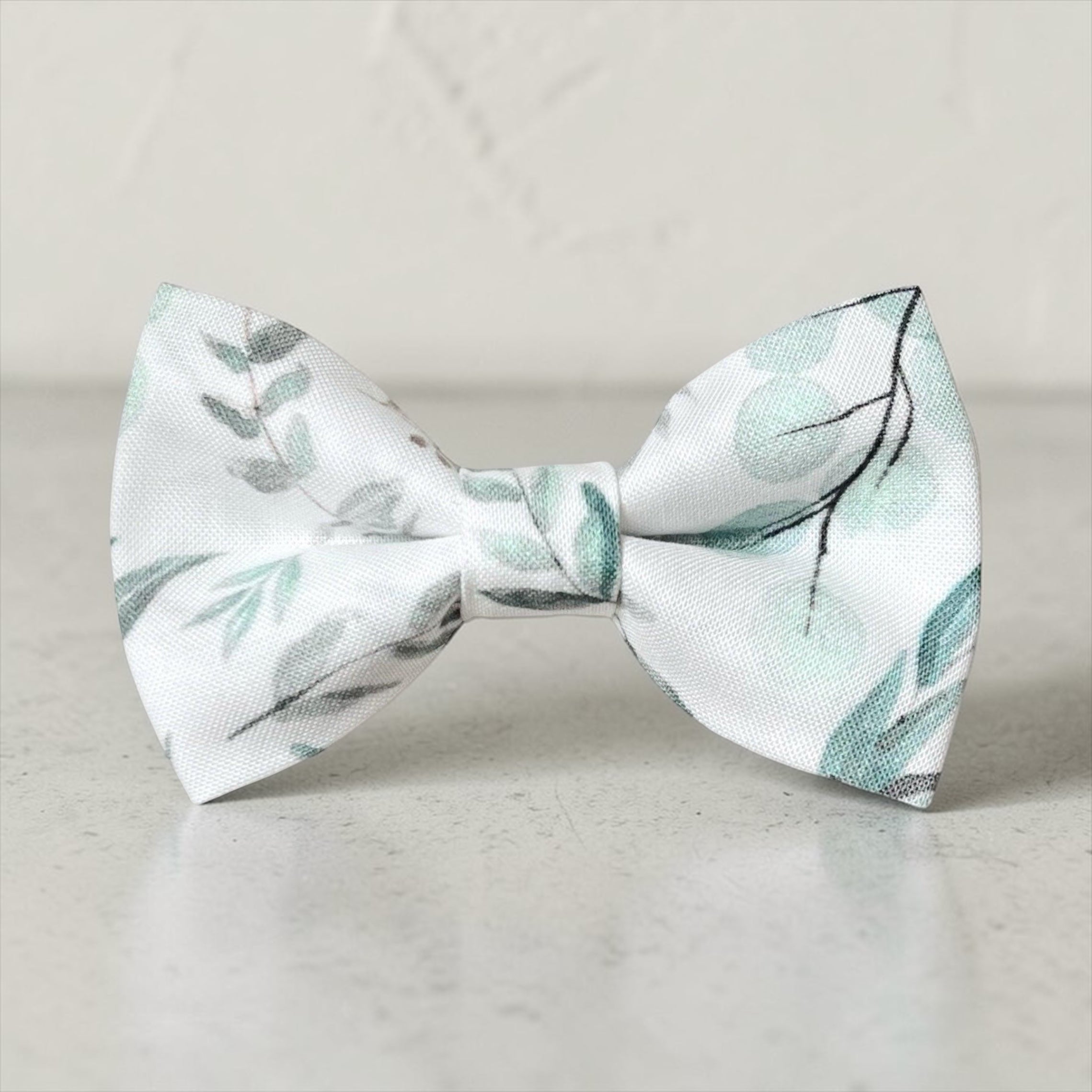 Floral patterned bow on a light gray background