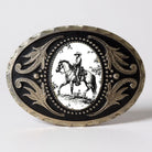 Decorative Cowboy belt buckle with a black background and white illustration of a person on horseback, on a light gray background.