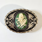 Decorative May flower green lily of the valley belt buckle with floral design on a white background
