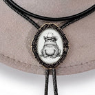 Handmade bolo tie with frog image.