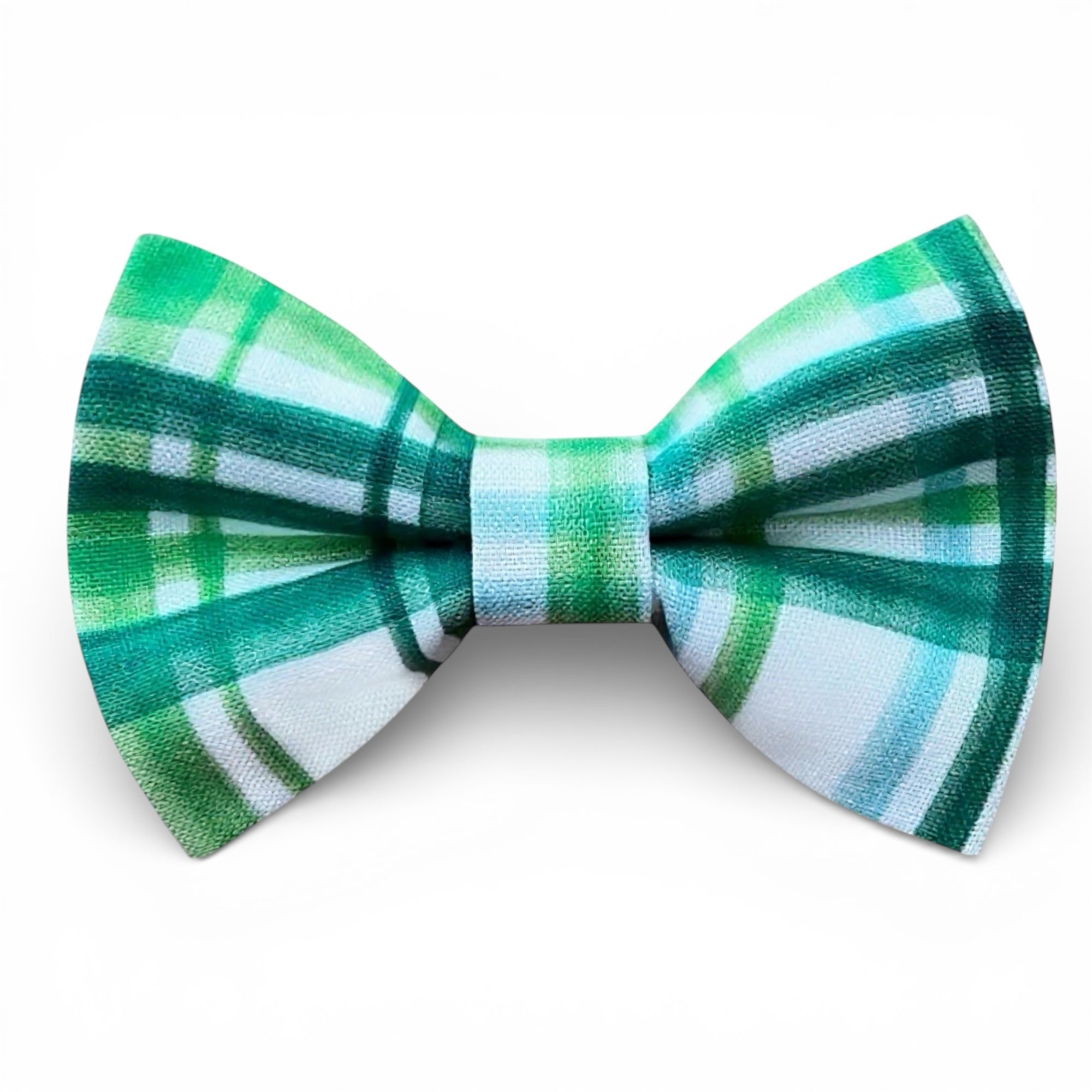 Green and white plaid bow tie on a white background for St. Patrick’s Day.