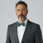 Groomsman in a navy blue floral bow tie for a wedding.