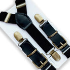 Black suspenders with brass clips on a white background for groomsmen, ring bearers and wedding guests.