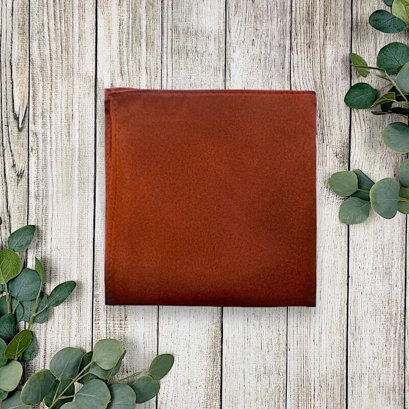 Burnt orange pocket square in terracotta fabric for men groomsmen and weddings.