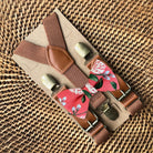 Size chart for suspender and bow tie sets from The Bold Bow Tie. X-Small (6mo-4yr): 15"-23" suspenders, 3.5" bow. Small (5-9yr): 18"-33" suspenders, 3.5" bow. Medium (10-12yr): 18"-33" suspenders, 4" bow. Adult (13yr-6'5"): 30"-53" suspenders, 4.5" bow. Big & Tall (Over 6'5"): 53"+ suspenders, 4.5" bow. Instructions note to measure from the back waistband over the shoulder to the front waistband for a comfortable fit.