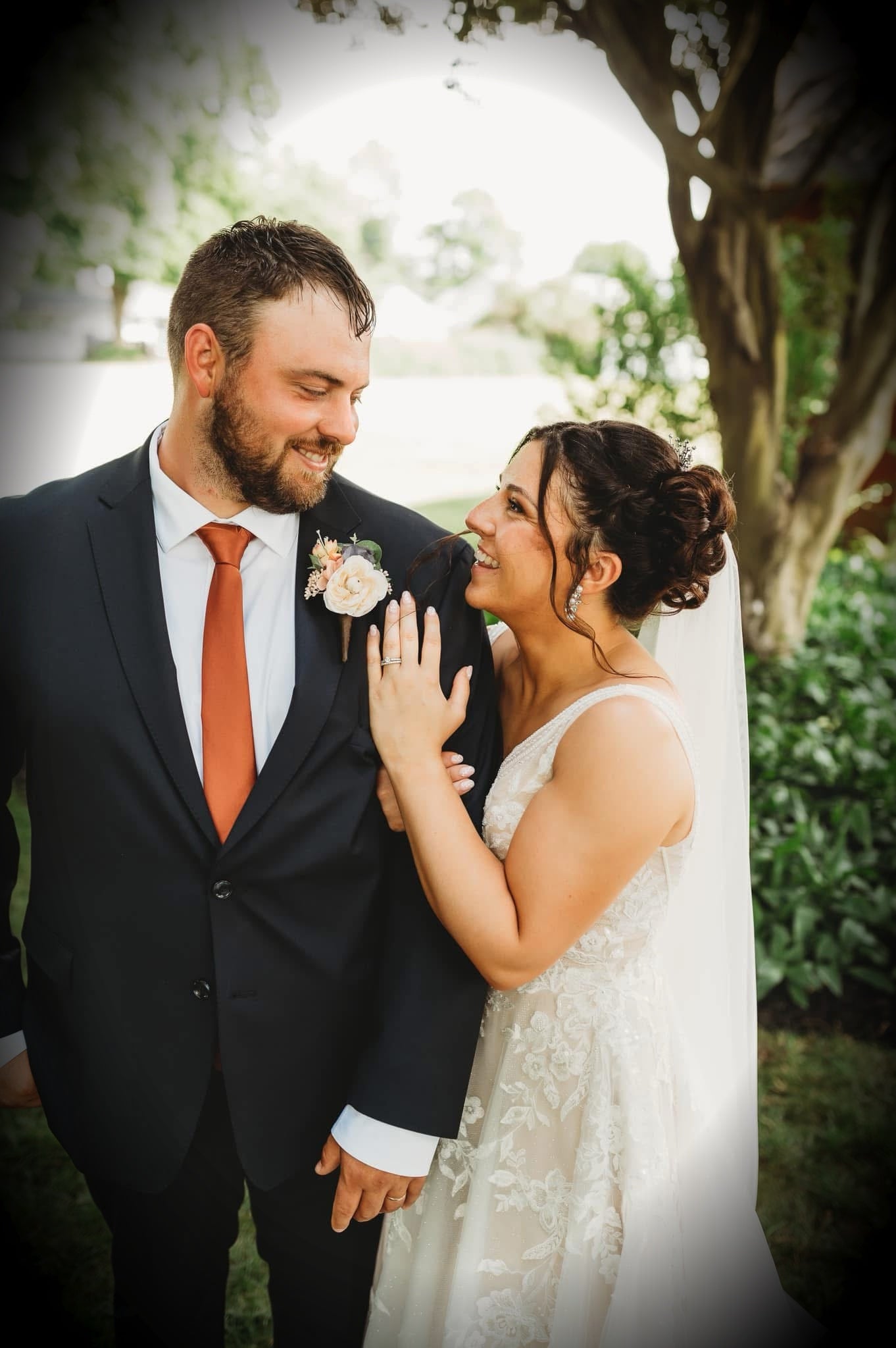 Terracotta necktie for men’s tie for wedding showcased by bride and groom.