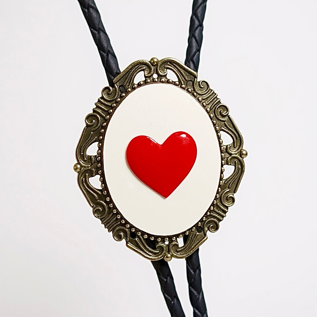 Valentines Day Bolo tie with red heart design on a white background