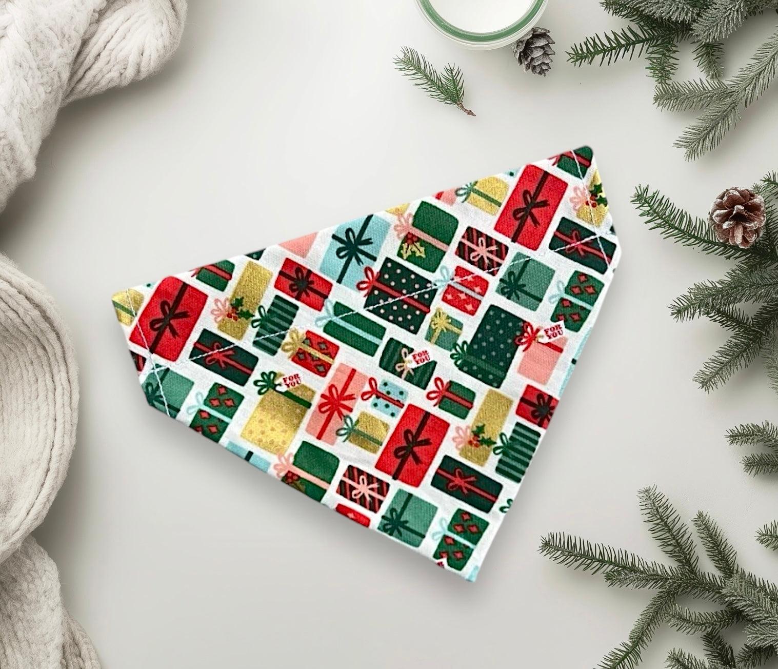 Close up of Christmas gift pattern bandana for pets in red green and gold
