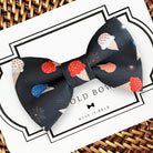 Patriotic Dog bow tie for the 4th of July with red white and blue ice creams on a navy background.