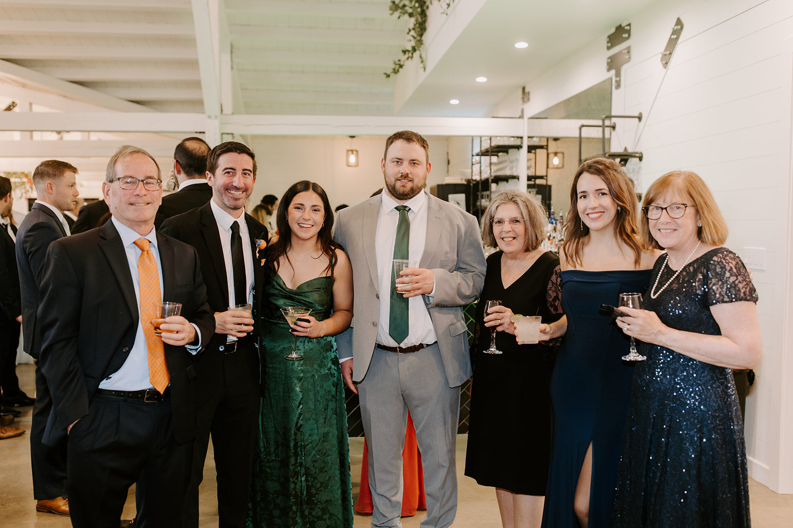Emerald green men’s tie for wedding being worn by a wedding guest and friends.