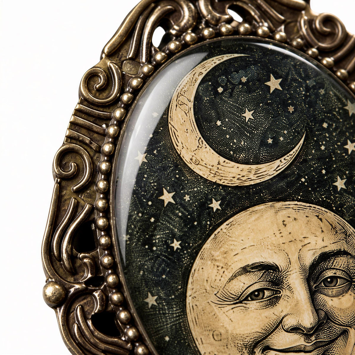a close-up of a decorative metal frame with a crescent moon and stars on its surface.