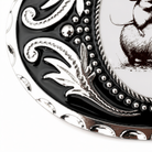a close-up view of a decorative metal plate with a black and white design.