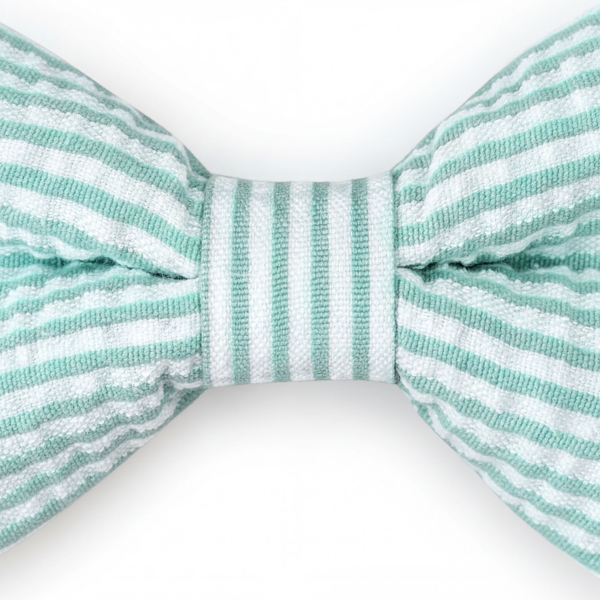 A close-up view of a mint green and white striped bow tie against a white background.