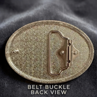 a close-up view of a shiny, metallic belt buckle with a textured surface.